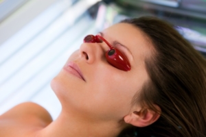Woman on sunbed wearing goggles