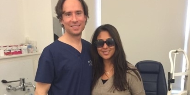 laser eye surgeon allon barsam with his patient